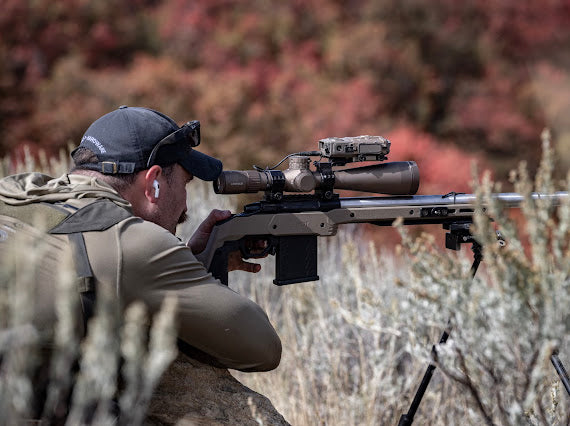 Precision rifle shooter practicing outdoors